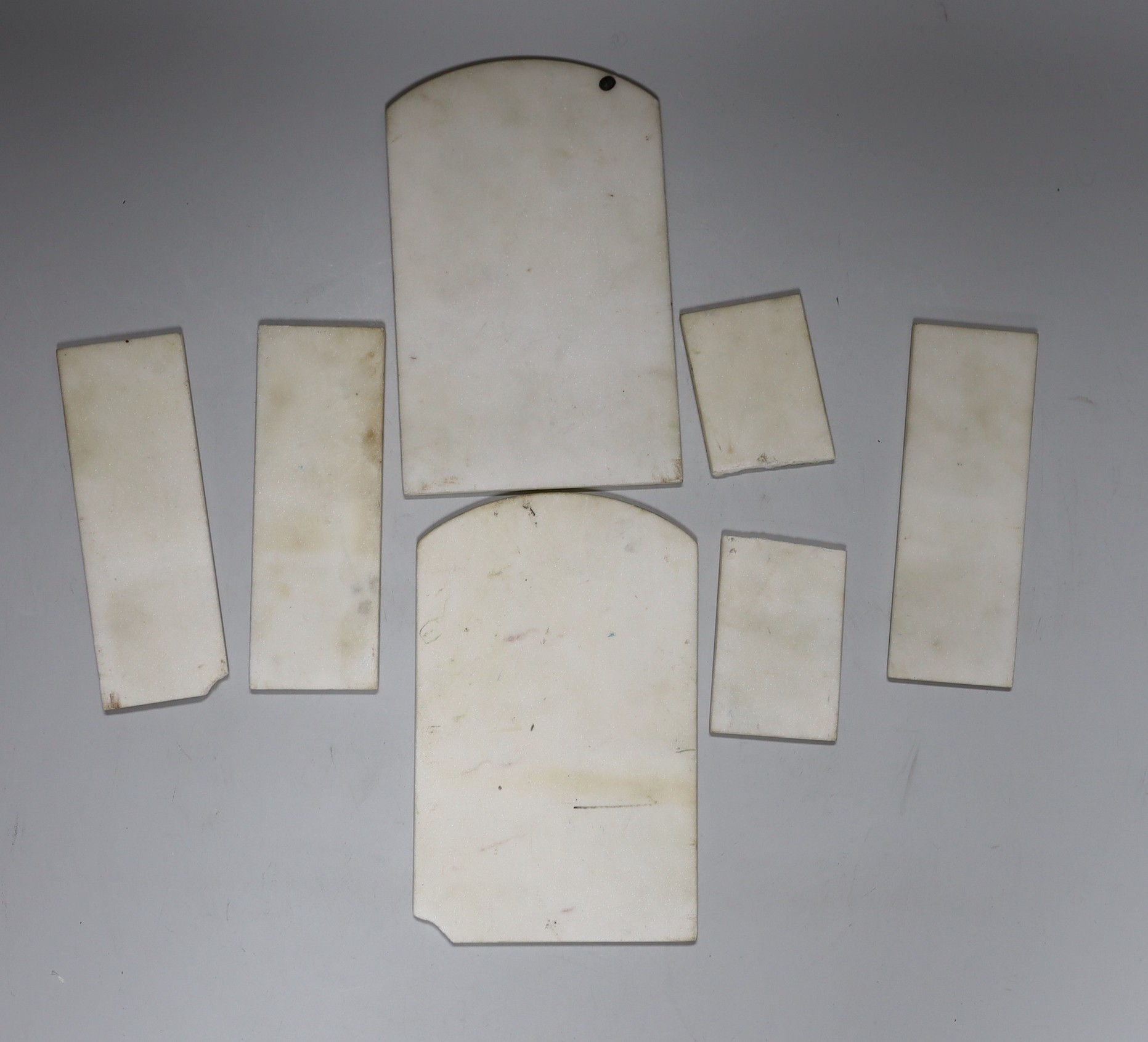 Six Chinese painted marble panels, largest 16 x 10cm